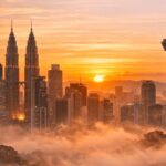 solo travel Malaysia scenic view of Petronas Towers at sunset