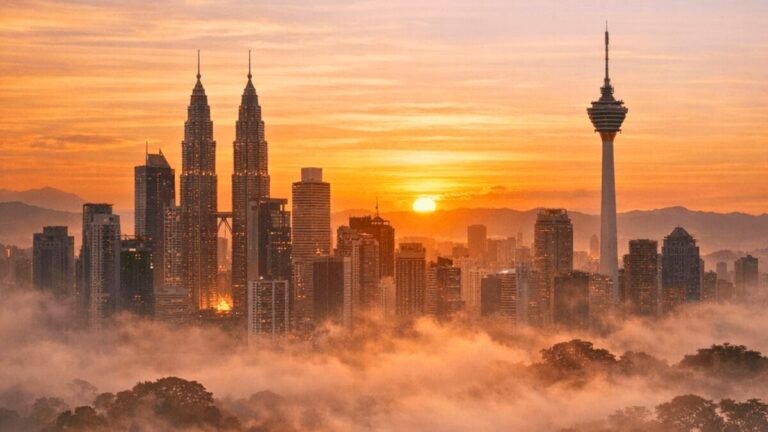 solo travel Malaysia scenic view of Petronas Towers at sunset