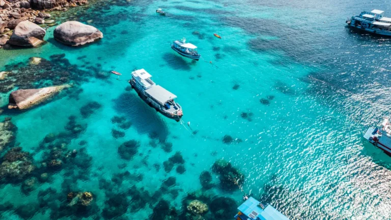 Boats and Crystal Clear Waters at the Bay Dive Site in Koh Tao