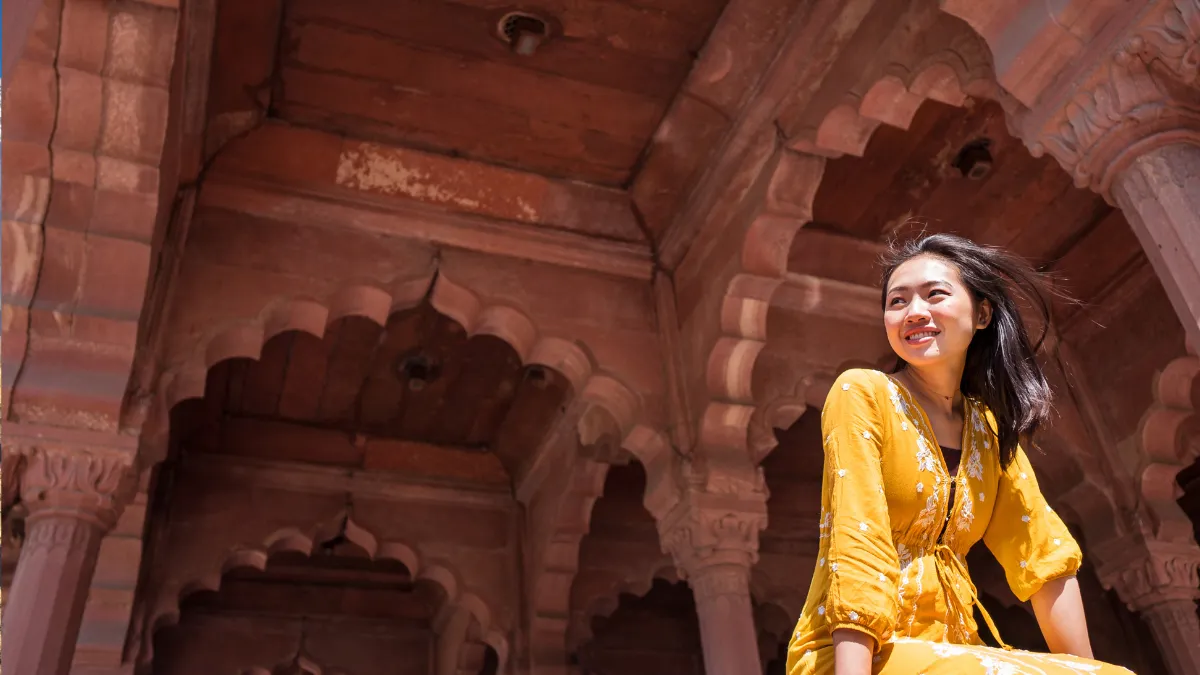 Sitting in an arch of the Red Fort
