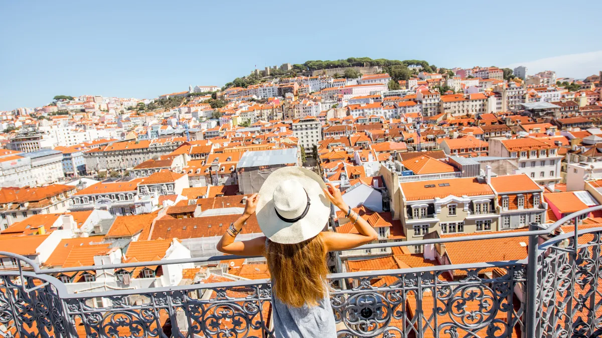 Solo traveler overlooking Lisbon, Portugal