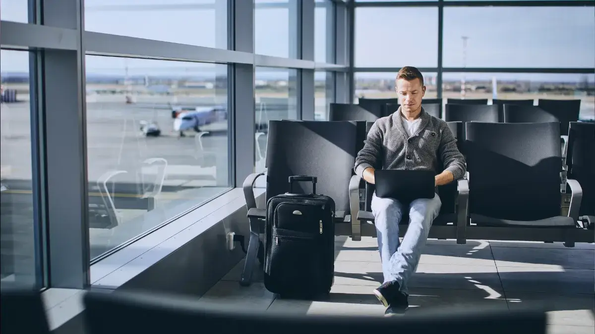 Working on laptop - Travel tech packing list 2026