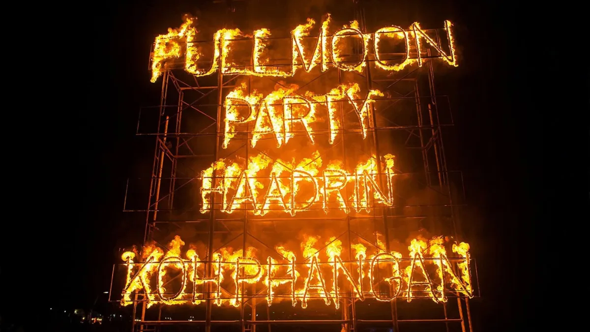 Burning sign reading “FULL MOON PARTY” and “KOH PHANGAN” - 4 day Koh Phangan itinerary