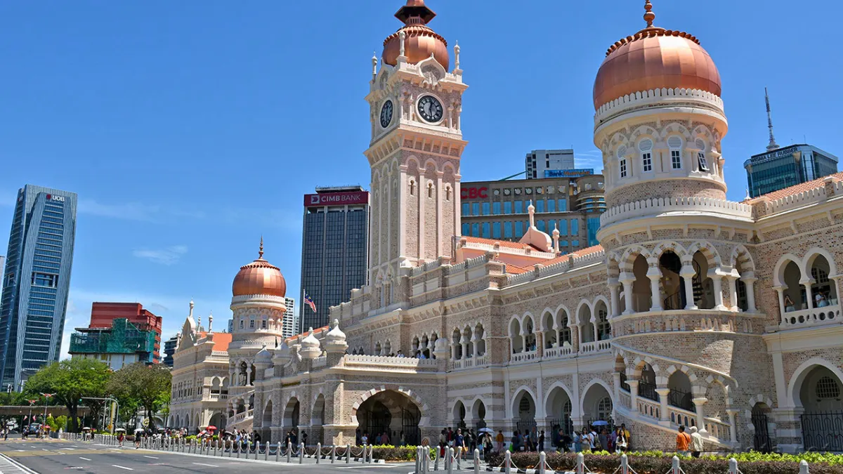 Sultan Abdul Samad Building with copper domes and a clock tower in Kuala Lumpur, Malaysia