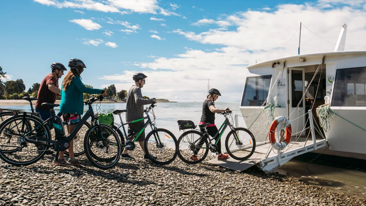 Boarding Mapua Ferry Group of friends cycling Tasmans great taste trail