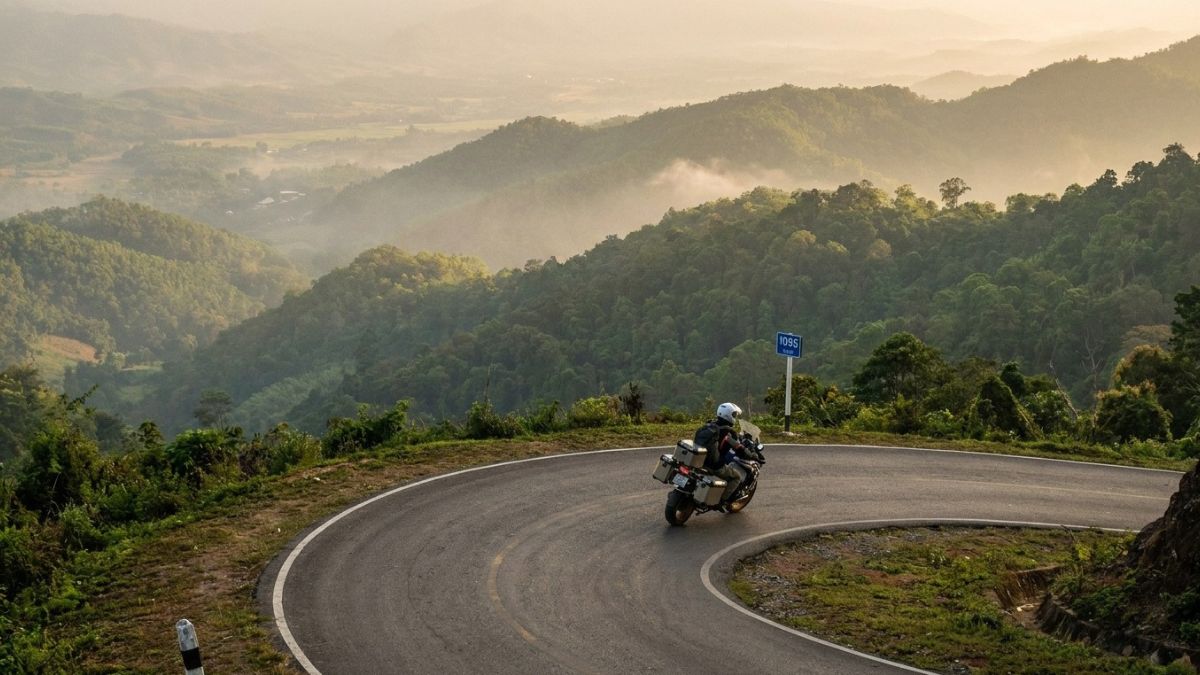 Motorbike rider on Route 1095 during the Mae Hong Son Loop, northern Thailand