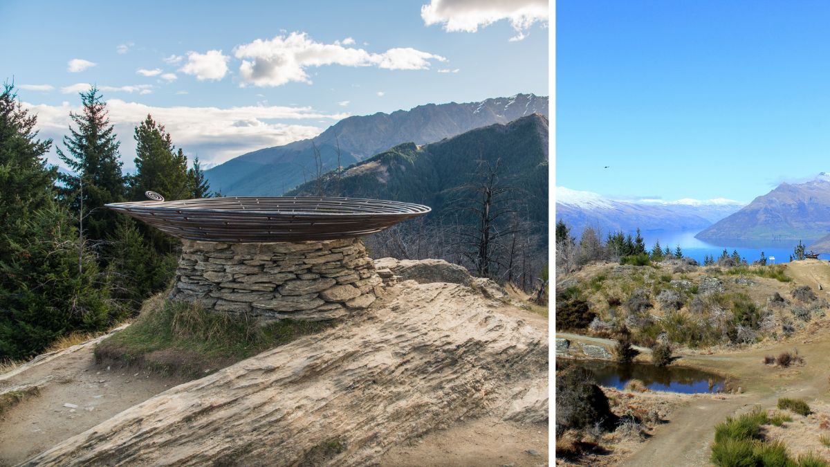 Stone-and-wood sculpture overlooking a forested mountain range, beside a mountain landscape with a blue lake